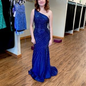 Worn once, no alterations, like new. Gorgeous sapphire blue with train.